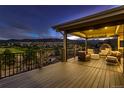 Spacious outdoor deck with comfortable seating, mountain views, and ample room for entertaining at 8661 Hunters Hill Ln, Littleton, CO 80125