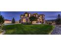 Sprawling two-story home boasts mature landscaping, stone accents, and charming craftsman-style details at 8661 Hunters Hill Ln, Littleton, CO 80125