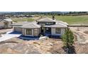 Beautiful single Gathering home featuring a modern design, professional landscaping, and an attached three car garage at 6176 Oxford Peak Ln, Castle Rock, CO 80108