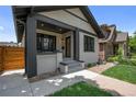 Exterior angle shot showcasing the charming facade, landscaping, and welcoming entrance at 2569 Forest St, Denver, CO 80207