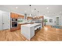 Bright kitchen with an island, stainless steel appliances, and modern cabinetry at 1490 S Vine St, Denver, CO 80210