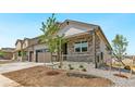 Attractive home featuring a stone-accented porch and professional landscaping at 4316 Gypsum Ave, Mead, CO 80504