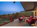 Inviting deck area with comfortable seating, offering stunning views of the surrounding forest and a tranquil retreat at 812 Aspen Rd, Golden, CO 80401