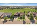 Spacious single-Gathering home near a golf course, surrounded by lush landscaping and manicured lawns at 22023 E Heritage Pkwy, Aurora, CO 80016