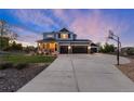 Charming two-story home with inviting porch, landscaped yard, and a three-car garage plus a separate one car garage at 5181 Appleton Way, Castle Rock, CO 80104