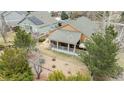 Aerial view of a home featuring a covered patio and landscaped backyard at 1479 Short Grass Ct, Castle Rock, CO 80109