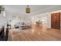 Bright living room with hardwood floors, neutral tones, and an open floor plan at 770 Locust, Denver, CO 80220