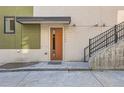Exterior shot of the front entrance, displaying the door, house number, and front stairway at 3150 Vallejo St, Denver, CO 80211