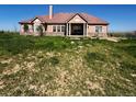 Charming single-story home featuring a classic design and well-manicured front lawn at 13291 N Harback Rd, Bennett, CO 80102