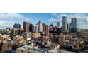 Panoramic city view featuring modern skyscrapers and a bright, clear sky at 1411 Wynkoop St # 806, Denver, CO 80202