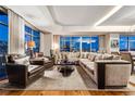 Spacious living room with city views and sectional sofa at 1411 Wynkoop St # 806, Denver, CO 80202