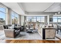 Spacious living room with city views, featuring stylish seating and ample natural light at 1411 Wynkoop St # 806, Denver, CO 80202