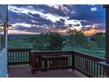 Wooden back deck featuring scenic views and railing at 7289 Stroh Rd, Parker, CO 80134