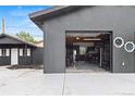 Spacious garage with a modern gym setup and an additional door for backyard access at 110 S Hoyt St, Lakewood, CO 80226