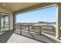 Enjoy panoramic views from this spacious covered deck, perfect for outdoor relaxation and entertaining at 3856 Treadway Pt, Castle Rock, CO 80108