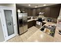 Modern kitchen with stainless steel appliances and ample counter space at 23080 York Ave, Parker, CO 80138