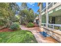 Landscaped backyard includes a patio and a spacious grassy area at 7762 S Eudora Ct, Centennial, CO 80122