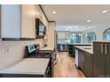 Modern kitchen with gas range and updated appliances at 7762 S Eudora Ct, Centennial, CO 80122