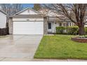 Charming single-Gathering home featuring a two-car garage, stone accents and well-manicured lawn at 22070 Day Star Dr, Parker, CO 80138