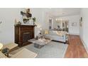 Bright living room featuring hardwood floors, fireplace, and stylish furniture at 2929 N Josephine St, Denver, CO 80205