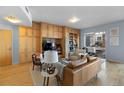 Comfortable living room featuring built-in shelves and cabinetry, with access to a balcony offering natural light at 1438 Little Raven St # 310, Denver, CO 80202