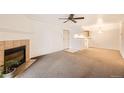 A spacious living area with fireplace that flows into the kitchen for seamless entertaining at 10293 E Peakview Ave # F104, Englewood, CO 80111