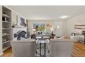 The living room boasts a fireplace and sleek hardwood floors at 63 S Holman Way, Golden, CO 80401