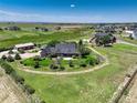 Sprawling green lawn surrounds this beautiful home, offering a tranquil and picturesque setting at 34827 E 7Th Ave, Watkins, CO 80137