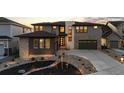 Charming two-story home with modern design, landscaped front yard, and inviting entrance at 7611 Copper Sky Ct, Castle Pines, CO 80108