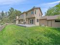 Expansive backyard with a spacious deck, perfect for outdoor entertaining at 31412 N Bermuda Dunes Dr, Evergreen, CO 80439