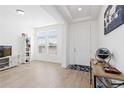 Bright living room boasts hardwood floors, large windows, and neutral walls at 11033 Olathe St, Commerce City, CO 80022