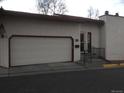 Charming townhouse featuring a convenient attached garage and landscaped front entrance at 1511 Belero St, Broomfield, CO 80020