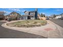 Charming two-story home with a blue exterior, well-manicured lawn, and a cozy front porch at 8653 Red Clover Ct, Parker, CO 80134