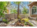 Tranquil backyard with seating, mature trees, and lovely landscaping at 2364 S Harlan St, Lakewood, CO 80227