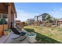 Beautiful backyard with a patio and relaxing lounge chairs at 7251 S Old Hammer Way, Aurora, CO 80016