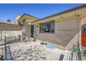 Brick detail on the house's exterior with an enclosed patio area at 2826 S Lamar St, Denver, CO 80227