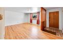 Bright living room with hardwood floors and a large window at 2826 S Lamar St, Denver, CO 80227