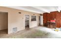 Living room leading into the kitchen with a serving hatch at 9995 E Harvard Ave # 257, Denver, CO 80231