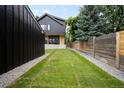 Spacious backyard with lush green grass, modern shed and well-kept fence at 863 S Race St, Denver, CO 80209