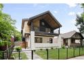 Stylish two-story home featuring a contemporary design with a balcony and well-maintained landscaping at 863 S Race St, Denver, CO 80209