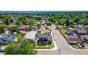 An aerial view of the property shows the neighborhood with a mix of houses and greenery at 550 S Raleigh St, Denver, CO 80219