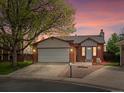 Charming single-Gathering home has a manicured front yard and attached two car garage at 10536 Garrison St, Westminster, CO 80021