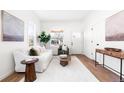 Bright and airy living room featuring hardwood floors and tasteful furnishings at 333 Quitman St, Denver, CO 80219