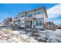 Charming two-story home with blue and gray siding and large windows at 14106 Red Cosmos St, Parker, CO 80134