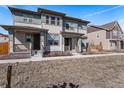 Inviting two-story home with covered front porch and neutral color palette at 14106 Red Cosmos St, Parker, CO 80134