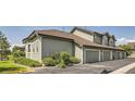 View of a well maintained apartment building showcasing modern architecture and a neatly paved parking area at 2700 W Greens Pl, Littleton, CO 80123