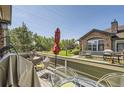 Inviting porch with comfortable seating, ideal for enjoying outdoor views and relaxing in a peaceful setting at 2700 W Greens Pl, Littleton, CO 80123