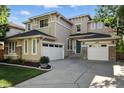 Charming two-story home featuring a three-car garage, tasteful landscaping, and a welcoming façade at 10601 Chadsworth Ln, Highlands Ranch, CO 80126