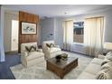 Inviting living room with bright white walls and neutral toned furniture at 8746 Mariposa St, Thornton, CO 80260