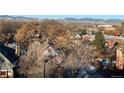 Scenic view overlooking the town, showcasing trees and mountains in the background at 410 Acoma St # 518, Denver, CO 80204